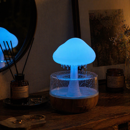 Nimbus Rain Hub in blue ambient mode on a wooden desk at night